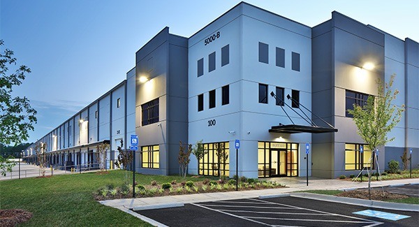 A modern warehouse building at night