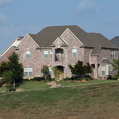 Exterior of brick home in Bishop Arts by Platinum Painting