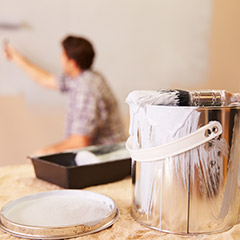 Man painting interior wall