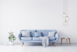 pale blue walls of a living room with a pale blue couch 