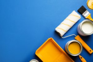 painting supplies gathered on a floor