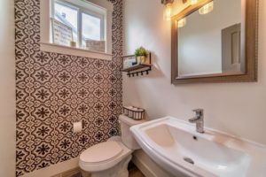 a bathroom with an accent wall