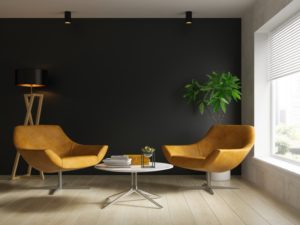 a sitting room that's painted with neutral colors