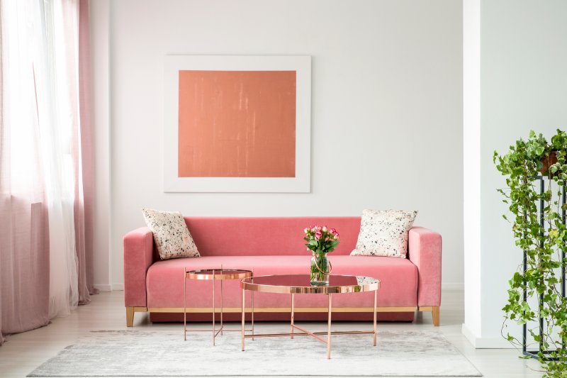 millennial pink couch in living room