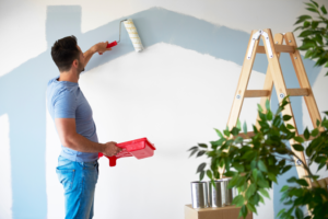 a man painting his living room