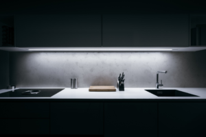 a modern kitchen filled with black appliances 