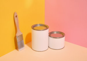 an assortment of colored paint cans