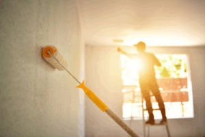 a person kicking off an interior painting project